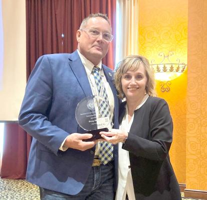DOUG PARKER RECEIVES AWARD