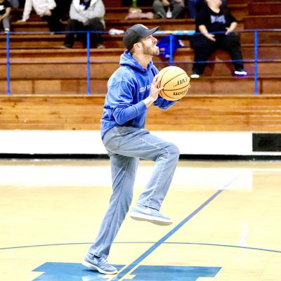 James Poulain, Pastor of the First Baptist Church, releases a half court shot at half-time of Holdenville’s game with Luther. Pastor Poulain’s shot was part of a promotion by Lavalley’s Insurance.