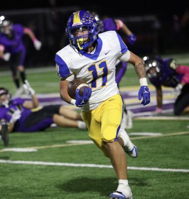 Holdenville running back # 11, Wyatt Seeley, races toward the end zone in the Wolverines’ 22-3 win over Community Christian. Seeley picked up 45 yards on the play and set up Holdenville’s second touchdown.