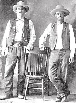 Holdenville’s first known Chief of Police, Cal Polk (left) with his brother Frank.