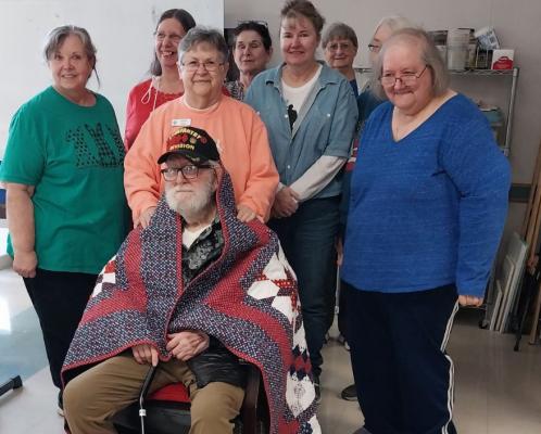 KOREAN WAR VETERAN GENE SIMS HONORED WITH QUILT OF VALOR