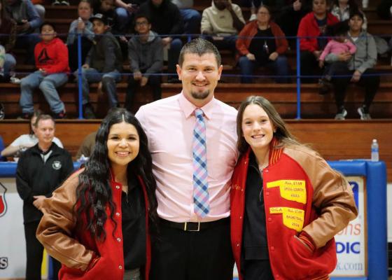 HOLDENVILLE HIGH SCHOOL HAD TWO PLAYERS THAT EARNED ALL-STATE HONORS DURING THE 2023-2024 BASKETBALL SEASON. Ryleigh Hill and Madi Bell McFarland were honored during Holdenville’s game with Wewoka and presented with All-State Jackets. Hill and McFarland wore their jackets while they posed for a picture with Holdenville Head Coach, Dillion Snow.