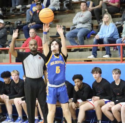 Jordan Stafford lets a shot fly in Holdenville’s game at Chandler. Holdenville win end the regular season on Monday night and host the district tournament on Saturday.