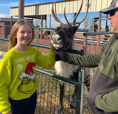 ONE OF SANTA’S REINDEER WAS SPOTTED AT MOSS SCHOOL! Melanie Williams (pictured above) and Mrs. Cates class were happy to get a visit from a real live reindeer!
