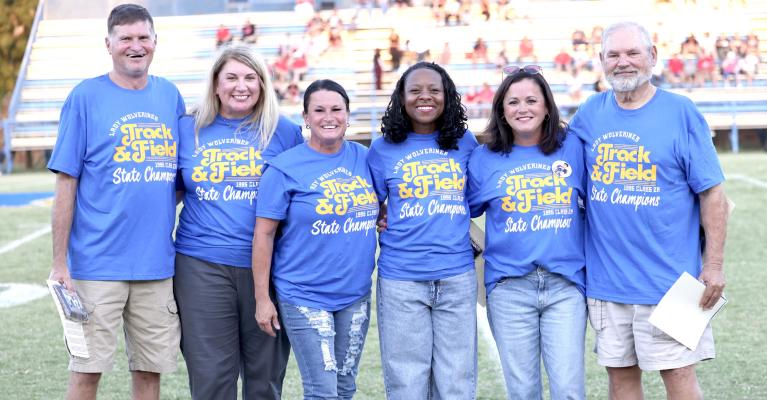 THE MEMBERS OF THE 1995 WOLVERINE STATE CHAMPIONSHIP TRACK TEAM WERE HONORED PRIOR TO HOLDENVILLE’S FOOTBALL GAME WITH NORTH ROCK CREEK. L to R.....Coach Larry House, Amanda (Heath) Warrington, Leslie (Curtis) Carter, Karolyn Anita (Lacy) Adams,Natalie (Treadwell) Tapley and Coach Steve Butcher.