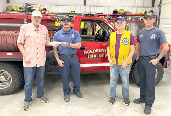 Lions Club made a donation to Holdenville Fire Dept. on 6-6-25. Pictured are: (l-r) Lion Larry Miller, Captain Chance North, Lion Les Radach, Firefighter Karter White.