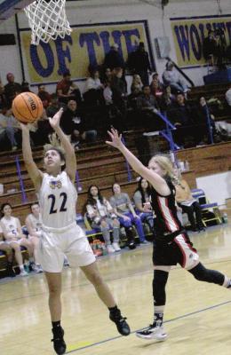 Holdenville guard, Blakeli Whiteman, scores two points for the Wolverines in the girl’s63-27 victory over Meeker. Holdenville will travel to Allen to play the Mustangs on January 4.