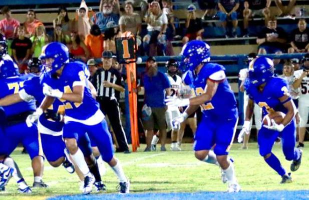 Holdenville running back # 3, Malachi Henderson, looks for running room behind the blocks of # 12, Bubbah Bowen and # 24, Xavier Randall. Holdenville lost a heart breaker to Meeker 28-22