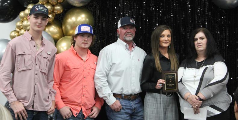 MONTE AND LINDSEY PHILLIPS FAMILY WINS DALE TURNER FARM AND RANCH FAMILY OF THE YEAR. Pictured above are Case Phillips (son), Tyler Freeman (Ranch Hand). Monte and Lindsey Phillips, and Dale Turner’s daughter, Tammy Turner Griffin.