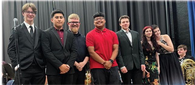 HOLDENVILLE GOLDEN PRIDE BAND SAID GOODBYE TO SIX VERY SPECIAL SENIORS LAST WEEK. These seniors have been an incredible edition to Holdenville bands over the years and will be deeply missed. Pictured above (L-R): James Westwood, Aaron Gonzalez, Band Director Sam Crosby, Zeke de la Rosa, Eli Hanson, Hailey Steele, and Madilen Bridges.