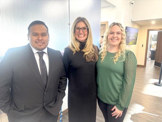 A rare break...Claudio Torres, Amber Gasaway, and Mackenzie Gilbert stopped counting money to enjoy some time at their open house this year.