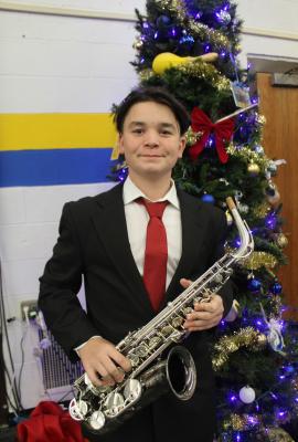 BRINGING IN SOME BLUES THIS CHRISTMAS is Matthew Gibb on the saxaphone.