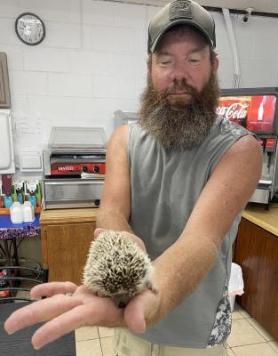 Cliff Grizzle and his pet hedgehog.