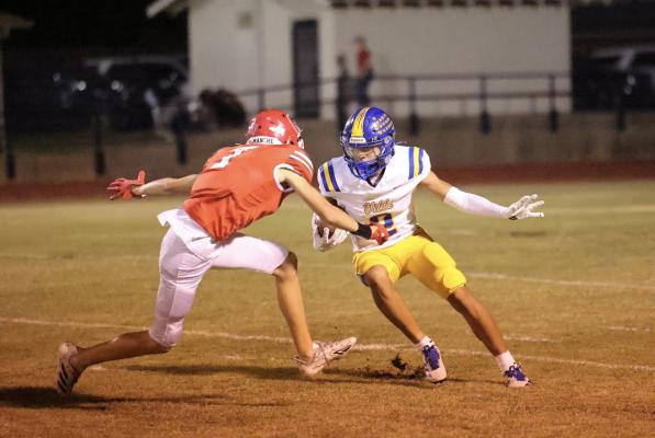Holdenville running back # 2, RJ Lowe escaped from this Comanche would be tackler and raced to the end zone. Holdenville will host Kellyville on Friday.