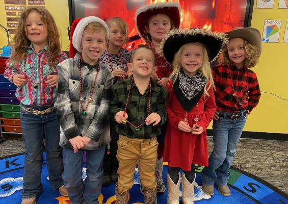 Cowboys and cowgirls from Mrs. Turner’s Kindergarten class at Moss School are pictured above at the Moss Cowboy Christmas Day. Pictured L-R: Back row: Harley Herron, Julie Wagoner, Rylee Pitts. Front row: Logan Moreno, James Anderson, Marble Mudd, and Alexis McNaughten