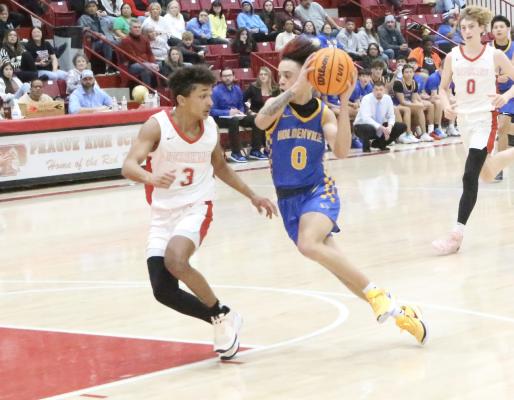 Holdenville’s Kase Sipes races by a McLoud defender on his way to the basket. Sipes averaged 17 points a game and was chosen as the MVP of the 66 Conference Tournament.