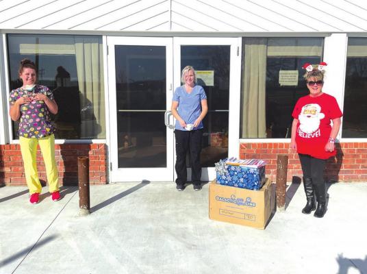 Karen Hefner, Warden’s Secretary at Davis Correctional Facility (pictured above with Heritage Village staff, Hayley Swift and Tesha Messenger) started a Christmas Card Campaign for the residents of Boyce Manor and Heritage Village Nursing Homes here in Holdenville.