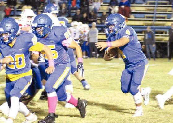 Wolverine charge.... Holdenville blockers # 20, Tatum Sanford and # 25, Elisha Tiger lead the charge to clear the way for # 4, Christian Zambrono. The Wolverines will travel to Crooked Oak this Friday for their last regular scheduled game.