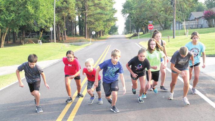 Ready! Set! Go! This group of Holdenville cross country runners take off on another sprint as they prepare for this Saturday’s meet. Holdenville will begin the 2021 season with the Wolverine Invitational at Holdenville Lake!