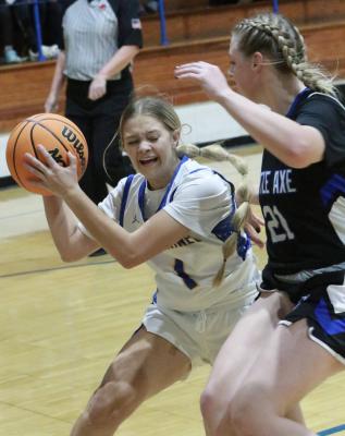 Daisy Wood grimaces as she prepares to shoot over a Little Axe defender. Dasiy made the shot in Holdenville’s win.