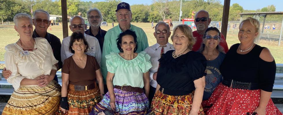 SWING YOUR PARTNER, DO-SI-DO! BOOTS AND BOWS SHOWED OFF THEIR SQUAREDANCING TALENTS AT DIZZY DEAN DAY RECENTLY. Pictured above are member of Boots and Bows: Front row: Mary French, Ruthie Hagan, Linda Tillerson Doolen, Mary Gantt, Debbie Akin and Jamie Mayfield Henry. Back row: Joe French, Paul Hagen, Stan Taylor, Andy Doolen, Rick Gantt and Steve Denton.