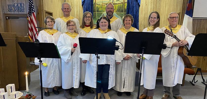 THE HOLDENVILLE CHURCH OF THE NAZARENE PRAISE TEAM HAD ONE OF THE BEST PERFORMANCES IN CHURCH HISTORY! The program, entitled Joy to the World, told the birth of Christ through Scripture and song ensembles and solos along with instrumentals. Pictured above are Front Row (L-R): Lorelei Schroyer, Jean Case, Marty Nichols, Becky Shields, Catherine Brigden, and Randy Case. Back Row: Ed Schroyer and Steve Bryant