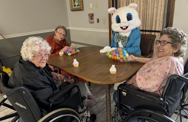 The Easter Bunny (Beth Ann Robinson) visited the residents at Heritage Village Nursing Center this past week. Gathered around the table with Bunny Robinson were Jane Keeney (left), Linda Hoover (center), and Diana Houser(right).