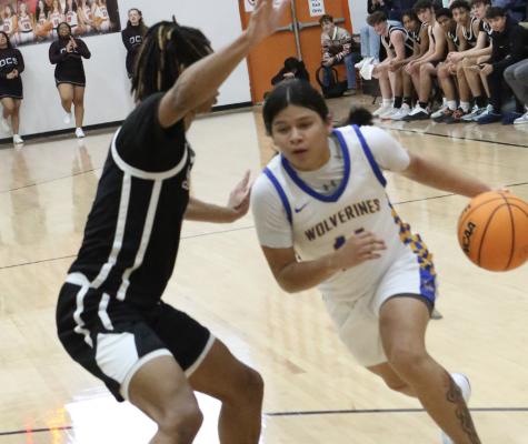 Holdenville’s, Kejo Watson, dribbles past a Destiny Christian defender on his way to the basket. Holdenville will travel to Okemah on Tuesday for an important 66 Conference match with the Panthers.