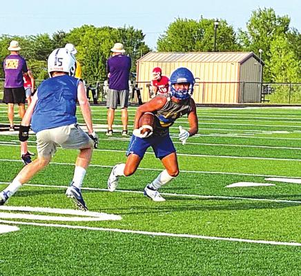 Izaia King put a move on this defender during a 7 on 7 passing league contest. Fall football practice is less than 3 weeks away and King is expected to be a major play maker for the 2021 Wolverines!