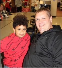 Dustin Elkins enjoyed a night of Cookies with Santa with his son Tylas. This event is hosted annually by Reed Elementary and includes cookies, pictures with Santa, and the elementary Christmas concert for grades Pre-K - 3rd