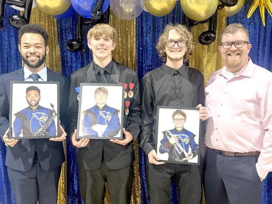 FINE ARTS HALL OF FAME INDUCTEES... Ty Phillips, Noah Higginds, and Colson Hall were each inducted in the Holdenville High School Fine Arts Hall of Fame this past week. They are pictured above with their Band Director, Sam Crosby