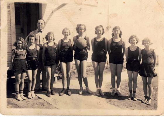 Pictured above with their coach Mr. LaValley is the girls basketball team from Benedict School in 1938. They are Crabtree, Geraldine Collis, Melba Thompson, Helen Phelps, Reba Bedwell, Ilene, Nadine Stone, Elaine Stone, and Norma Lee Wilson.