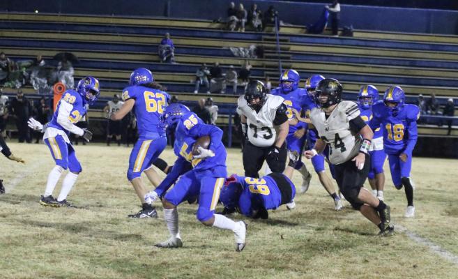Holdenville running back # 25, Mike Piza, heads unfield for a good gain while # 20 Malachi Henderson, # 62 Donovann Gibbs, # 66 Alyc Harjo,# 18 Tris-N Tyler and a host of other Wolverines clear the way. Holdenville will host Lexington Thursday Night.
