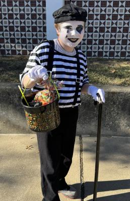 Jacob James Hudson says, “This candy is all MIME!” He had a great day downtown trick-or-treating.