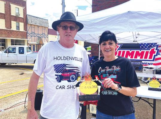 POPULAR VAN - John Fiely of McAlester took home two of the trophies that were designed specifically for the Spring Car Show on Saturday. Fiely won 1st Place in both the Special Interest and theChamber’s Choice categories with his 1964 Chevy van, which had a 60’s style customized interior. A full list of all the winners will be in next week’s Holdenville News.