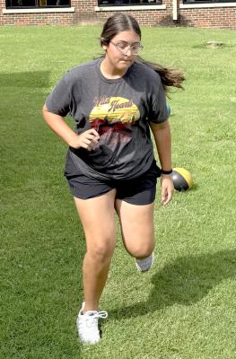 Lainey Brown races through an early morning workout in preparation for softball season.