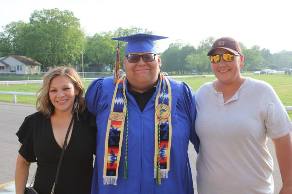 Isaiah Randell stopped for a quick picture and with his mom Marisela and Stephanie Dority before receiving his diploma