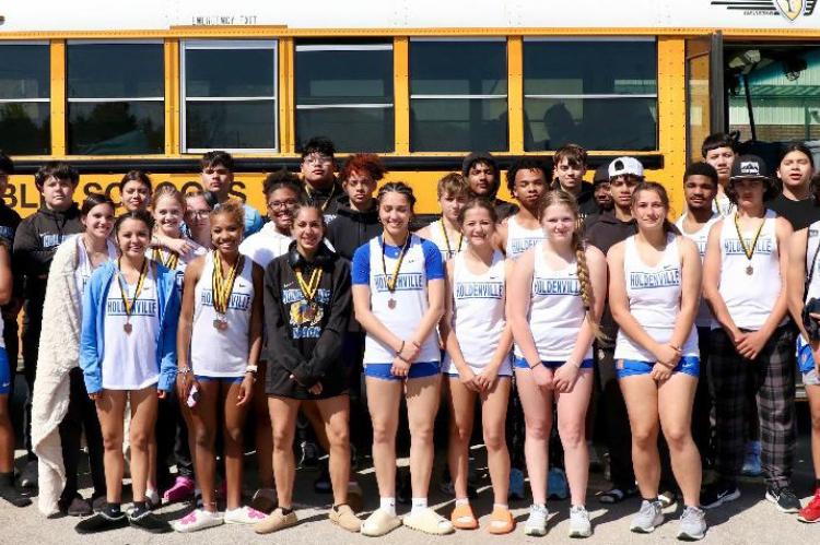 The Holdenville Wolverine track team will completely fill a bus! The Wolverines traveled to Henryetta last week for their first meet of the season. Several Wolverines won medals and they were proudly displaying the hardware they earned in the picture.