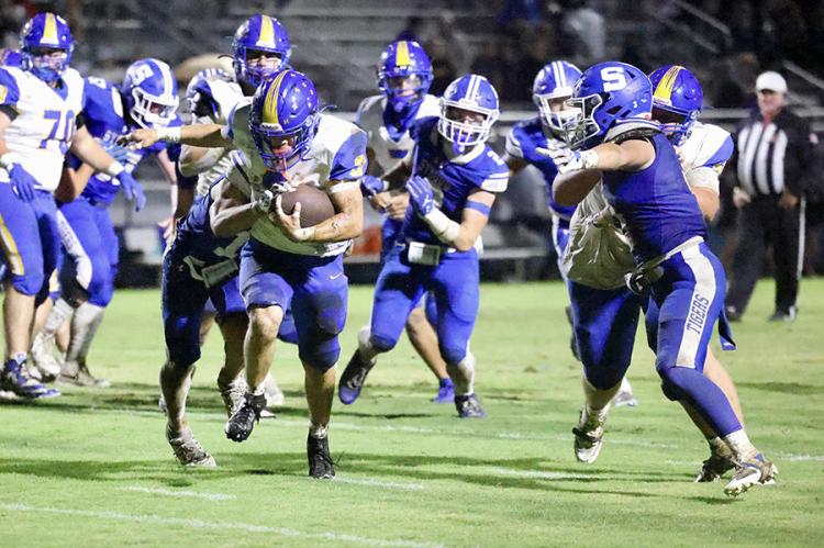 Hard to bring down! Holdenville running back # 3, Titus Gomez, proved to be hard to tackle in the Wolverines’ game at Stroud. Holdenville defeated Stroud 52-0.
