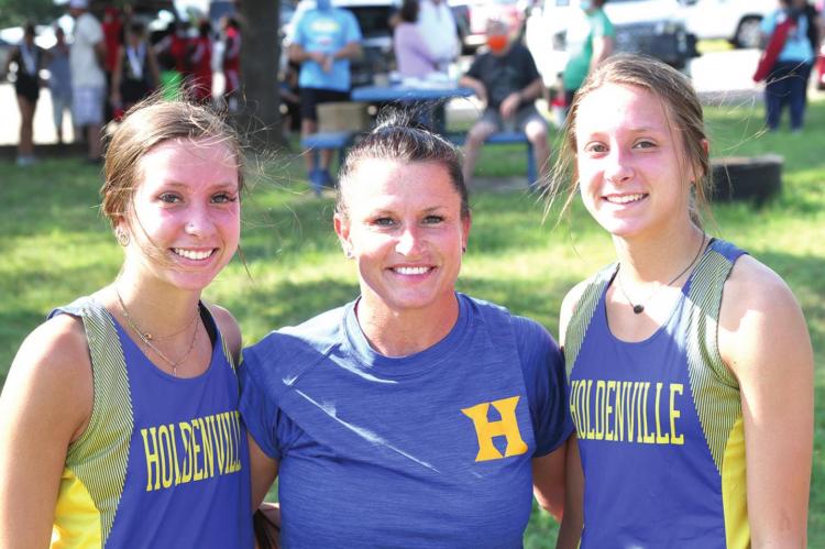 Wolverine Hall Of Fame Athlete Leslie (Curtis ) Phillips was all smiles when she posed for this picture with her twin daughters. Laynee and Leigha are following in their mother’s footprints as they continue to win championships for the Wolverines.