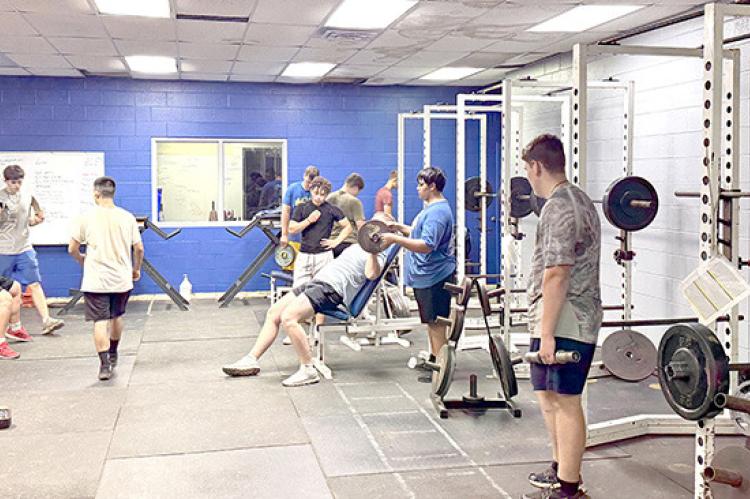 Summer Pride boys make good use of the weight facility which bears Coach Rawls’ name.