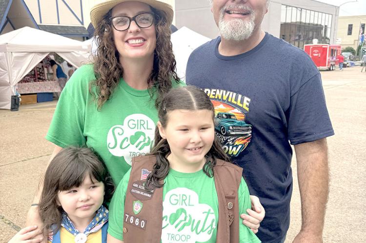 Members of Girl Scout Troup 7660 were impressed by many of the old cars this year. Pictured with mom and dad local business owners Cameron and Alicia Miller are Presley and August.