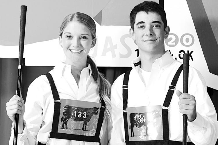 MADELYN GERKEN, Cashion, left, and Jackson Ray, Holdenville, right, represented Oklahoma at the 2020 National Junior Angus Showmanship Contest, held in conjunction with the National Junior Angus Show (NJAS), July 21-22 in Tulsa, Okla. Forty-nine youth from across the country competed for top honors in the 54th annual event. ~Photo by Pearls Pics on behalf of the American Angus Association.