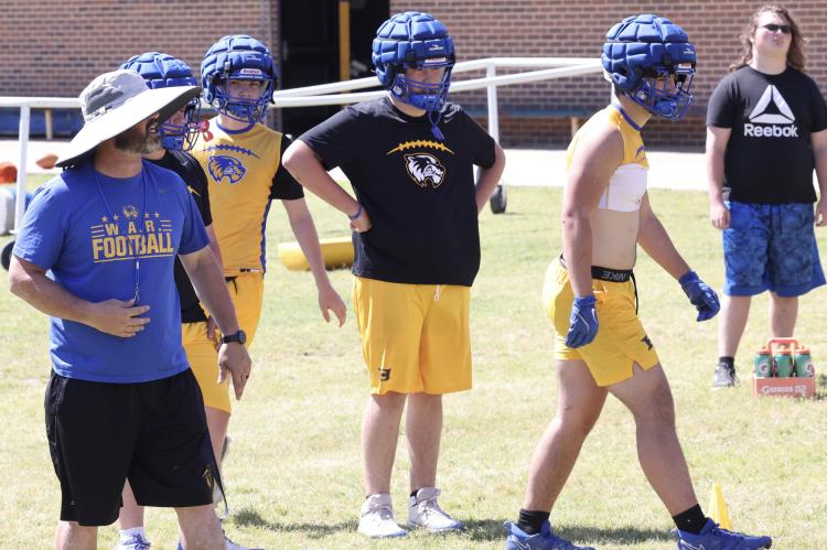 The coach in the floppy hat has brought winning football to Wolverine Land! Coach David Barker put his troops through some intense drills during a Spring Football workout.