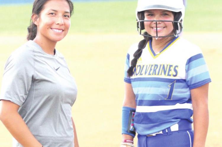 9070 - Holdenville Assistant Coach, Angel Johnson, gave Ryleigh Hill-Tiger some instruction during a time out in the Wolverines’ contest with the Valliant Bulldogs. Holdenville has games scheduled at Byng on Monday, Idabel on Tuesday and will play in the Prague Tournament Thursday - Saturday.
