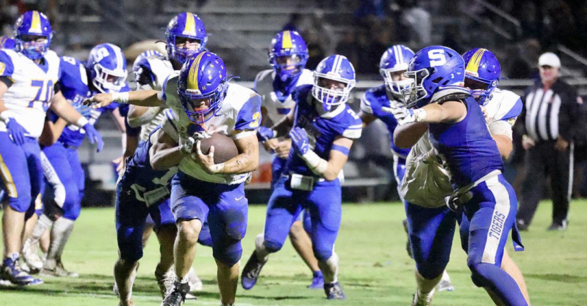 Hard to bring down! Holdenville running back # 3, Titus Gomez, proved to be hard to tackle in the Wolverines’ game at Stroud. Holdenville defeated Stroud 52-0.