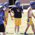 The coach in the floppy hat has brought winning football to Wolverine Land! Coach David Barker put his troops through some intense drills during a Spring Football workout.